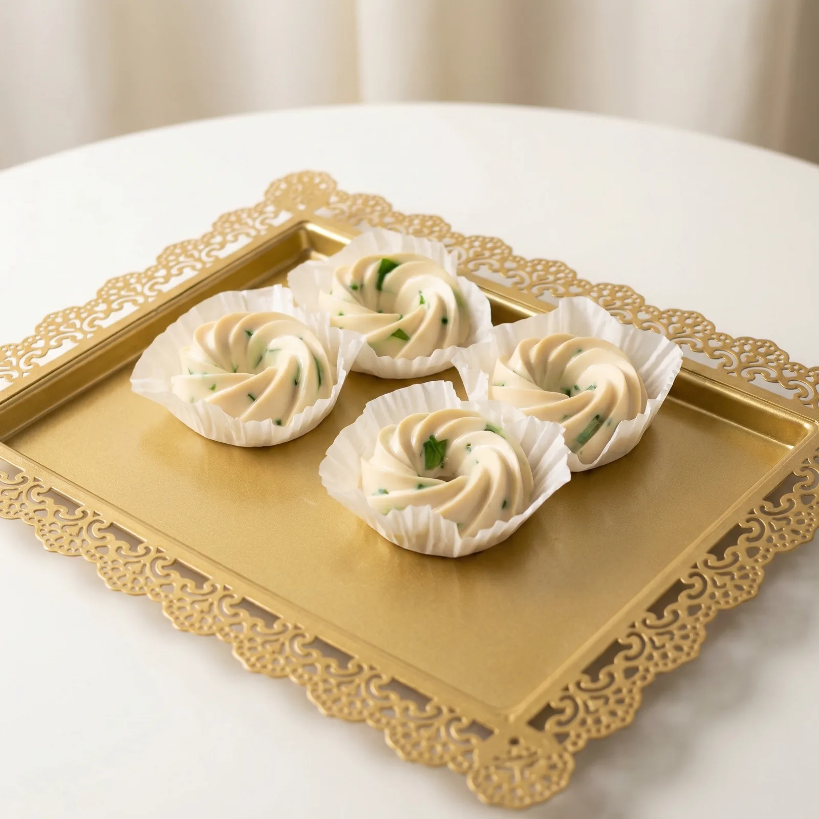 After: ring-shaped desserts on gold tray with clean neutral tabletop background